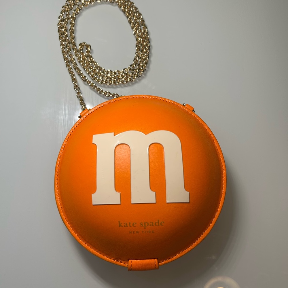 kate spade Orange Round Crossbody with White 'm' Applique